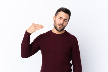 Young handsome man with beard over isolated white background with tired and sick expression