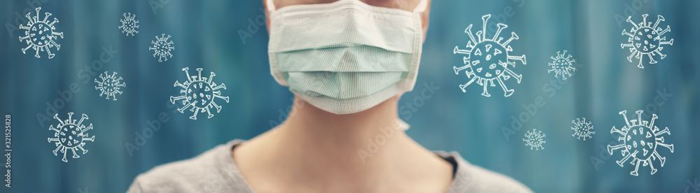 young woman in medical face protection mask indoors on blue background - obrazy, fototapety, plakaty 