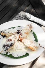 Wall Mural - fish skewers with creamy coconut sauce and rice in vietnam