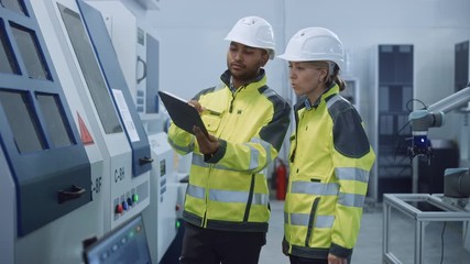 Poster - Chief Engineer and Project Manager Wearing Safety Vests and Hard Hats, Use Digital Tablet Computer in Modern Factory, Talking, Optimizing CNC Machinery, Programming Machine for Increasing Efficiency