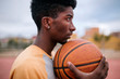 © Westend61 - Teenager holding basketball