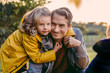 © Westend61 - Portrait of girl hugging smiling father outdoors in autumn