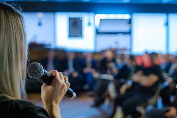 Female presenter speaks to audiences