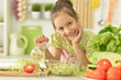 © aletia2011 - Cute girl preparing delicious fresh salad in kitchen