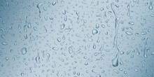 Background With Drops And Streaks Of Water In Light Blue Colors, Flowing Down The Surface