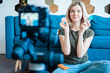 Young Woman Filming Video Blog On Camera, Blogger Influencer Profession Concept
