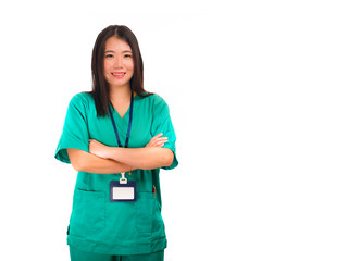 young beautiful and happy Asian Chinese medicine doctor woman or hospital nurse in green scrubs posing cheerful smiling confident in corporate clinic staff portrait