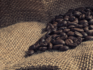 Wall Mural - Brown roasted coffee beans on sackcloth