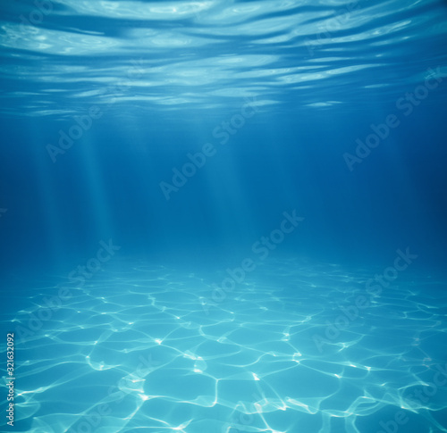 Underwater empty swimming pool background with copy space