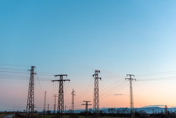 Electric pole telephone cable post sky blue clouds sunset pastel orange copy space