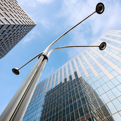 Wall Mural - modern office architecture and lamp post under blue sky and clouds