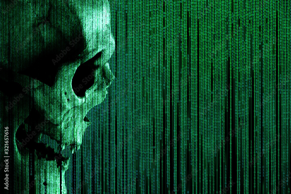Human skull on green binary code matrix background. Side view of a ...