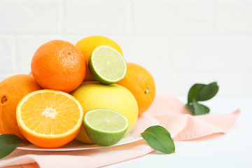 Different citrus fruits on the table. Juicy citrus fruits.