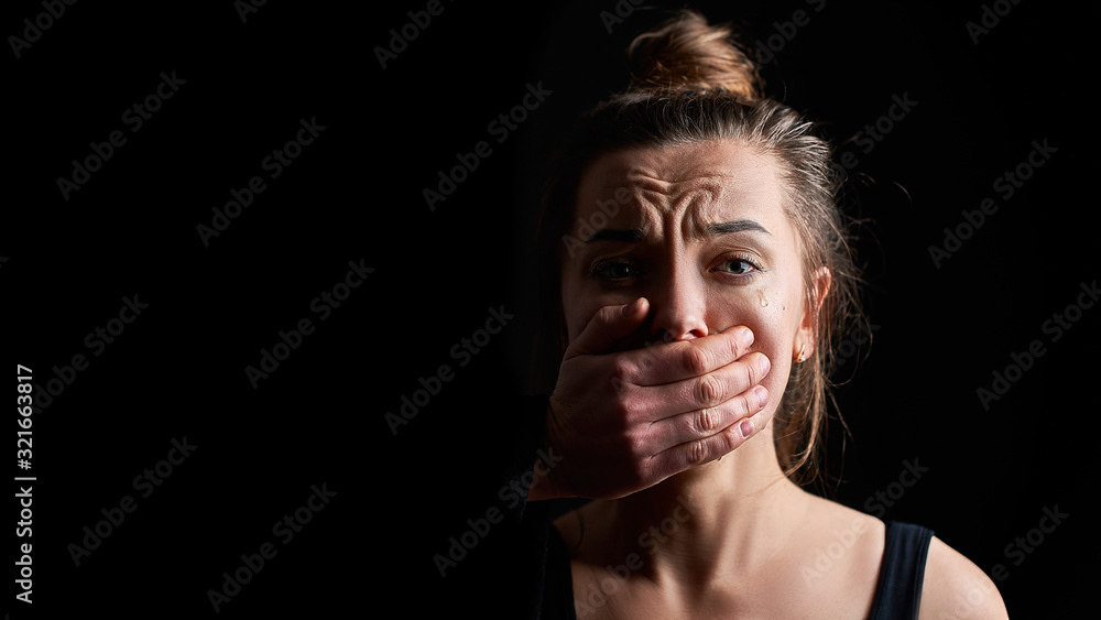Stressed unhappy crying woman victim in fear suffering from female domestic violence having life difficulties and social problems - obrazy, fototapety, plakaty 