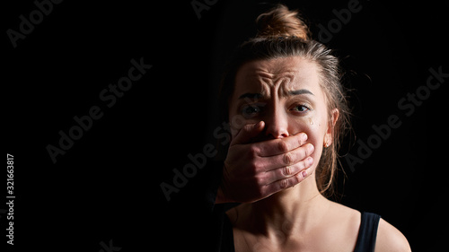 Fotomural Stressed unhappy crying woman victim in fear suffering from female domestic viol