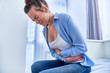 Sick female suffering from stomachache during pain menstruation period or gastrointestinal system disease