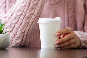 woman holding a cup of coffee