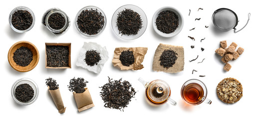 Wall Mural - Black tea and accessories top view on white background