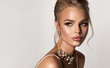 Beautiful girl with set jewelry . Fashion woman in a necklace and earrings . Beauty , cosmetology and accessories.