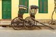 Hand pulled rickshaws are parkedon the street. Kolkata. India