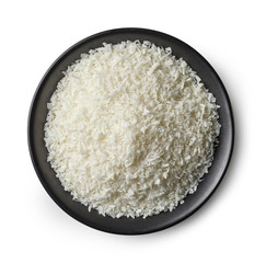 Poster - bowl of coconut flakes on white background