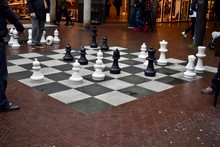 People Are Playing Chess On The Big Size Chess Board On The Street