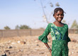  African black schoolgirl walking and posing with beautiful big eyes and looking at camera
