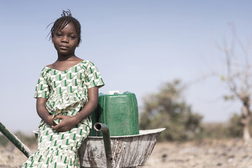 working african ethnicity infant getting pure water in a natural environment