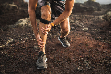 Wall Mural - Runner using Knee support bandage and have a problem with leg injury on running. Periosteum problem or sprain ligament.