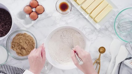 Sticker - Step by step. Flat lay. Mixing ingredients in a glass bowl to make chocolate chip cookies.