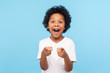 © khosrork - Hey you! Portrait of happy little boy with curly hair pointing finger to camera and laughing loudly with surprised face, teasing making fun of you. indoor studio shot isolated on blue background
