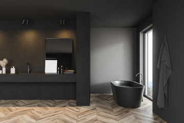 Comfortable dark gray bathroom interior