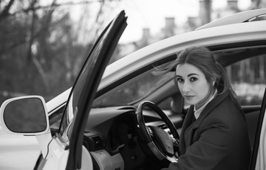 Business lady style, woman with a car, concept of modern young lady lifestyle