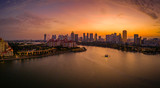Fototapeta  - Kallang river overlooking at the stadium and Singapore skyline during sunset
