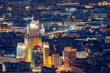 Wall Mural - Panorama of Evening Moscow from a height. Buildings of the capital of Russia at night. Residential, office and religious buildings. Tall building. Cathedral Of Christ The Saviour. Big city lights.