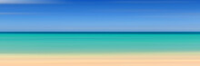 Panoramic View Of The Sandy Beach Of The Sea, Blurred Summer Background. Blue Sky, Sea And Yellow Sand.
