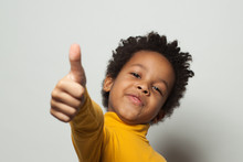 Happy African American Child Boy Showing Thumb Up On White Background