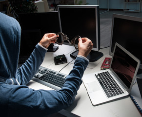 hacker hacking computer at night