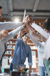 © Prostock-studio - Inspired manager giving high five to his international young team