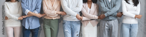 Fotografía Close up of business team holding each other crossed hands