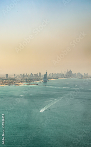 Fotomural Aerial view of Dubai coast and Marina Skyline at sunset
