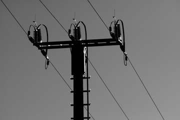 Wall Mural - High voltage power line tower on sky background.