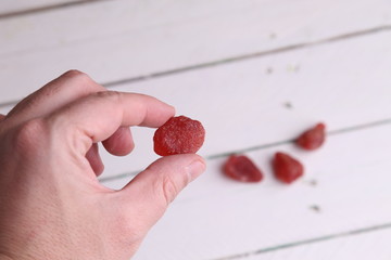 Wall Mural - piece of dried strawberries fruit in color background