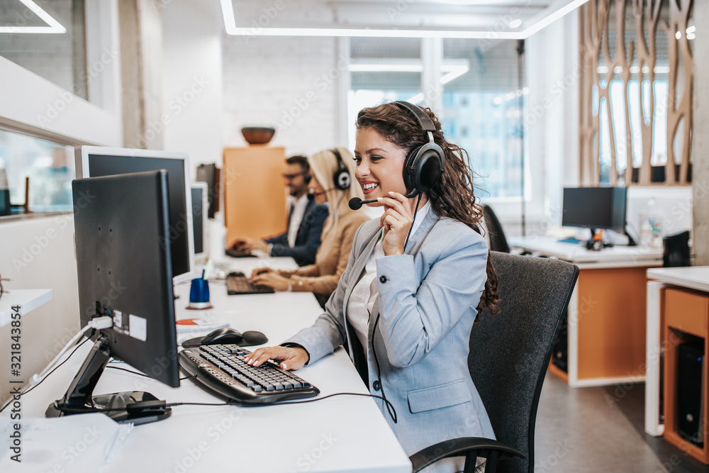 Team of call center employees working together on office. Stock Photo ...