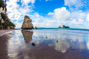 Canvas Print - Mirror reflections of clouds in wet sand