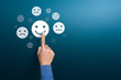Customer service experience and satisfaction survey concepts. The client's hand choose the happy face smile face with copy space