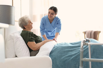 Sticker - Care worker with elderly woman in geriatric hospice