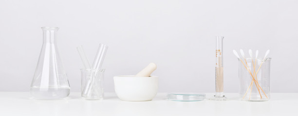 scientific laboratory glassware with mortar and pestle, medical research and development concept, pa