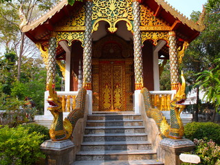 Temple in Chiangmai Thailand Beautifully decorated with wonderful colours statues of Buddha, Payanak, and Monks on walking street in the old city