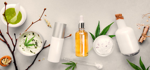 Wall Mural - Cosmetics with cannabis CBD oil on light background. Concept natural skin care. Banner